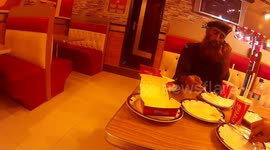 Adventurer treats his Armed Escort to Junkfood