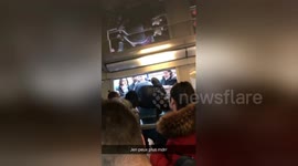 Desperate commuters board train through windows during French rail strike