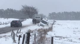Van crashes into ditch in snow on Scottish country road