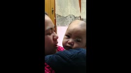 baby kissing his mom