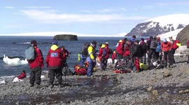 Tourists waiting to leave the beach at Brown Bluff, Antarctic Peninsula