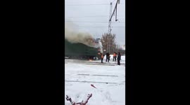 Clever railway men douse train blaze with snow