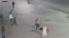 Cops are hunting two men who battered a bloke in Trafalgar Square so badly he never regained consciousness