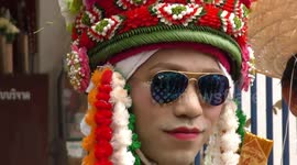 Boys riding elephants to enter the monkhood