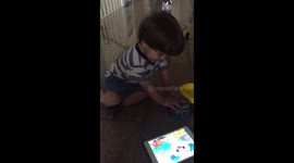 Baby playing with tablet