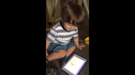 Baby playing with tablet