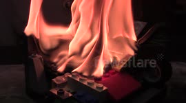 Red hot nickel ball sets ablaze and melts a set of Lego blocks