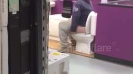 Man relieves himself in DIY shop display toilet
