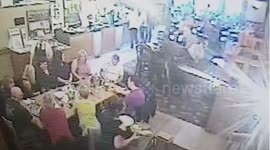 Waitress slips over in front of customers