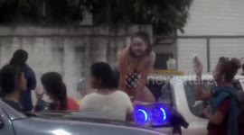 Thai woman arrested after letting passers-by grope her during new year party