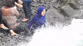 Turbaned women bathing