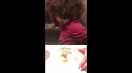 Skylar trying Brussel sprouts