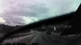 Dashcam video captures flying ice cracking car windshield
