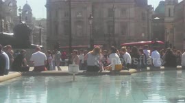 People enjoying fountains at Trafalgar square furing the April heat 2018