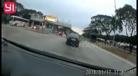 Out-of-control bus smashes through toll booth into car