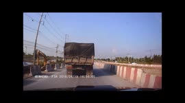 Going, going gone! Truck topples over after skidding on dusty road