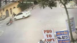 Accident at crossroads between motorbike and car