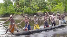 Bisj Pole Ceremony, War-canoe escort, Omandecep, Asmat Region, Papua, Indonesia