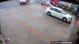 Truck skids off road and crashes during heavy rain