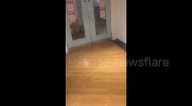 Moment water gushes from ceiling in Leeds student flats flood