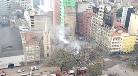 Firefighters sift through burning wreck of Sao Paulo tower block