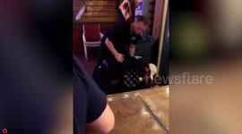 This is the shocking moment a black man was held down by five white security guards and elbowed in the face before being dragged out of a nightclub