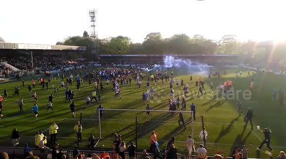 Rochdale fans invade the pitch after team avoids relegation
