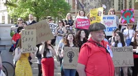 Pro and anti Demonstrators chant and shout at each other by the new Emily Pankhurst statue in Parlement square london uk by Jim Connor