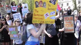 Pro and anti Demonstrators chant and shout at each other by the new Emily Pankhurst statue in Parlement square london uk by Jim Connor