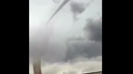 Man running for bus trips and falls.