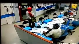 Brave clerk chases after bank robbers despite getting shot twice