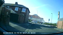 Lady running with pushchair falls in front of car