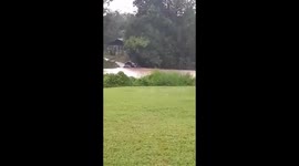 Family of five washed away after driving across flooded river