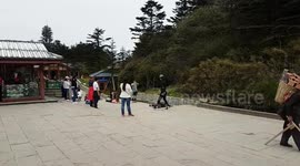Devout Buddhists and labourers on Mount Emei Shan China