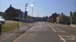 Ignorant Biker rode of of drive without checking for oncoming traffic, very close miss