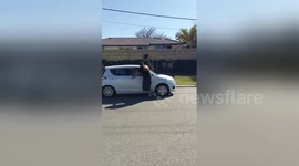 Man dragged down road by moving car in Australia