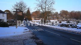 farmers tractor and rural cars in snow lane
