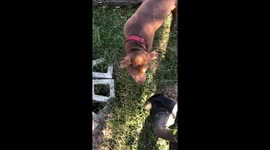 Pit bull protects owner from weed eater