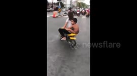 Woman arrested after riding motorbike with three-year-old nephew on the back