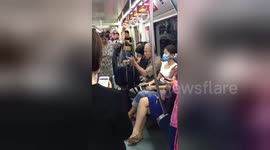 Two Chinese argue in English on Beijing subway