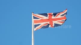 Union Jack flaps against London blue skies
