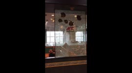 Heavy monsoon rain causes water to leak through restaurant ceiling in Thailand