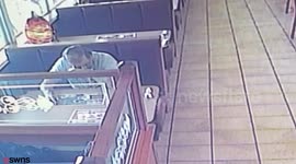 Restaurant customer caught on CCTV slapping waitress on backside while his wife went to the toilet