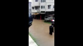 Savage of School children from flood appeared on road in Mangalore, INDIA.