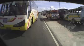 Motorcyclist helmet camera captures terrifying near miss with two over-taking buses