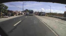 Motorcyclist helmet camera captures terrifying near miss with two over-taking buses