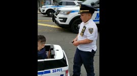 Young 'officers' guide fleet of police cars for NYC Memorial Day Parade
