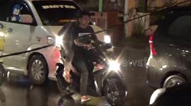 Chaos on Indonesian street as heavy rain causes power cable to collapse