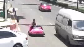 Woman pulled over for driving pink bumper car on busy street