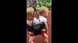 Twins in same swing
